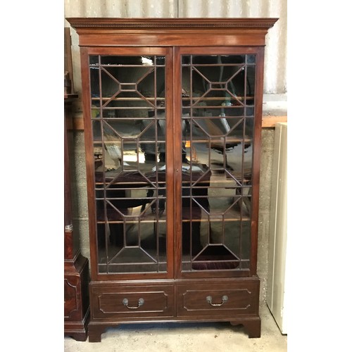 1365 - A two door glazed mahogany display cabinet with two drawers at base and lion head handles. 196cms h ... 