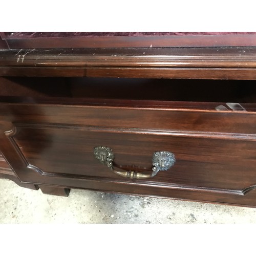 1365 - A two door glazed mahogany display cabinet with two drawers at base and lion head handles. 196cms h ... 