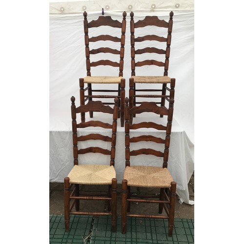 1367 - A set of four rush seated ladderback dining chairs. Height to seat 43cms, height to back 109cms. 42c... 