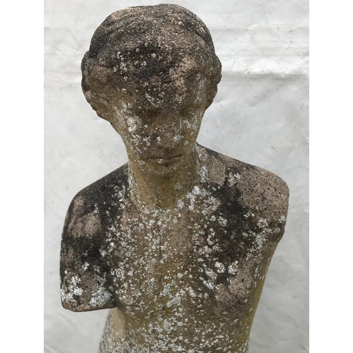 1557 - A reconstituted stone garden ornament of a lady. 96cms h x 30cms w at base x 25cms base length.