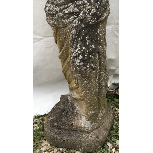 1557 - A reconstituted stone garden ornament of a lady. 96cms h x 30cms w at base x 25cms base length.