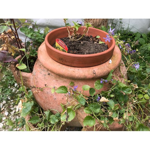 1558 - A reconstituted stone tree trunk bird bath and a terracotta planter. Bird bath 74cms h x 42cms w at ... 