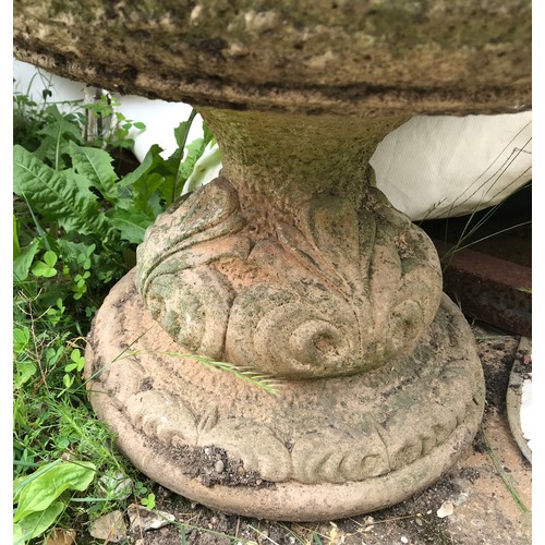 1559 - A pair of concrete garden urns with pedestal bases.