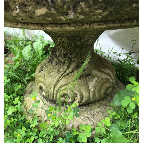 1559 - A pair of concrete garden urns with pedestal bases.