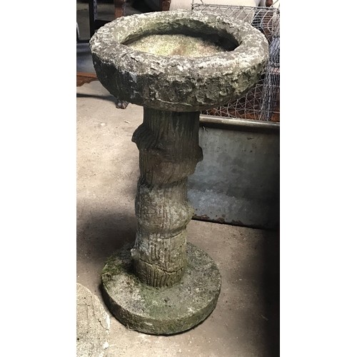 1566 - A concrete bird bath. 75cms h.