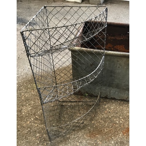 1568 - A large galvanised metal trough 186cms l x 49cms w x 40cms h together with a wire mesh corner shelf ... 