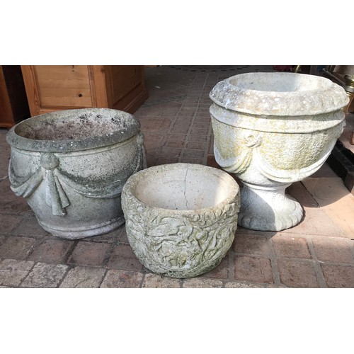 1573 - Three concrete garden planters to include one urn 42cms h x 38cms w, one with swag decoration and a ... 