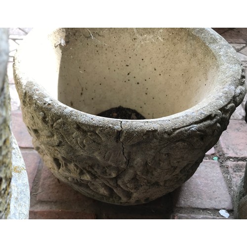 1573 - Three concrete garden planters to include one urn 42cms h x 38cms w, one with swag decoration and a ... 