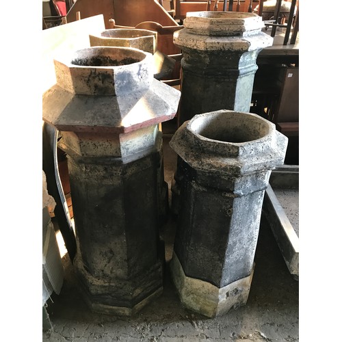 1575 - Seven octagonal chimney pots, one pair 101cms h, three at 94cms h, and small pair 74cms h.