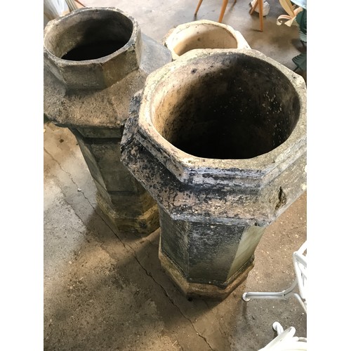 1575 - Seven octagonal chimney pots, one pair 101cms h, three at 94cms h, and small pair 74cms h.