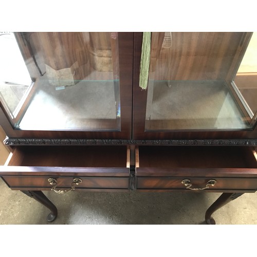 1535 - A mahogany two door display cabinet on carved cabriole legs, 2 drawers and brass handles. 160cms h x... 