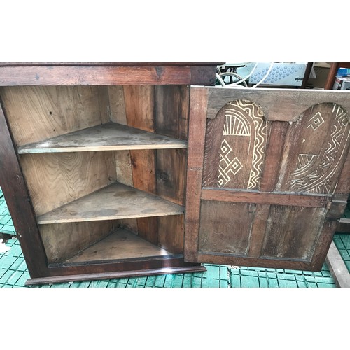 1358 - A Georgian oak corner cupboard, single four panel door, iron hinges. 87 w x 43 d x 94cms h.