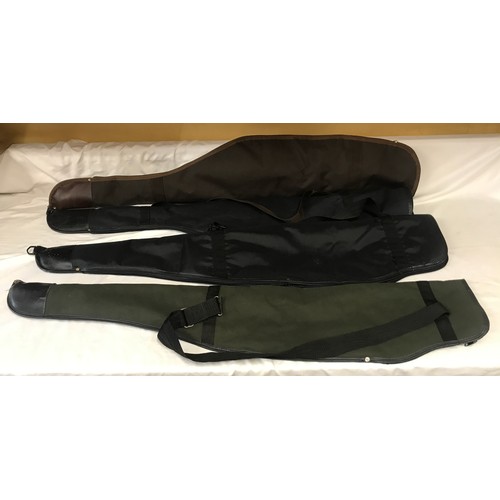 885 - Four gun cases, fur lines, 2 black, one green and one brown, 120cms l approx.