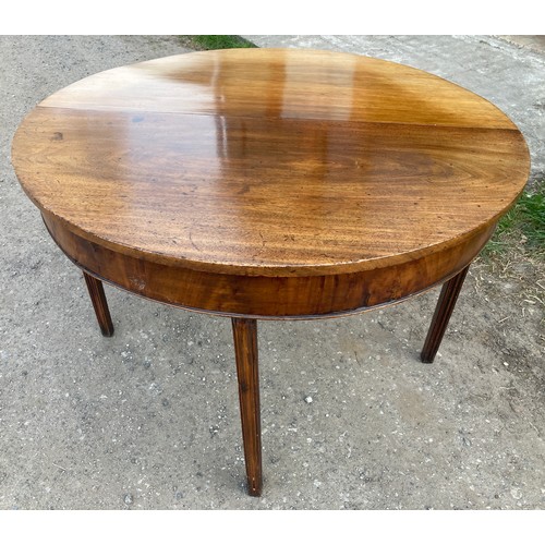 1358A - A demi-lune mahogany supper table. 105 x 107 cms x 72cms h. Leaf down 107 x 54cms.