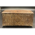 A vintage biscuit tin in the form of a carved oak coffer. 27 x 12 x 12cms h.