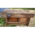 A vintage wooden workbench with cupboards to base at both sides. 153 x 78 x 78cms h with two Parkins... 