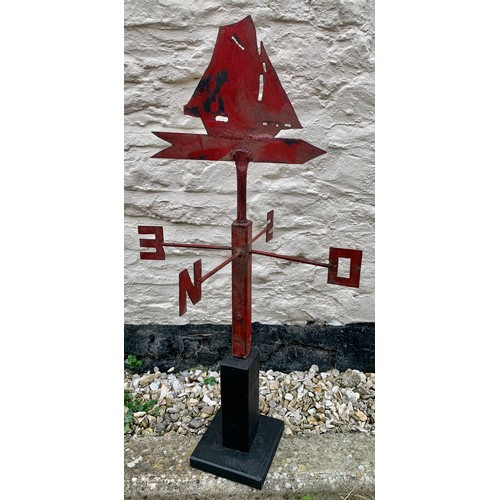 106 - Vintage metal sailing ship weather vane mounted on a wooden base. 81cms h.