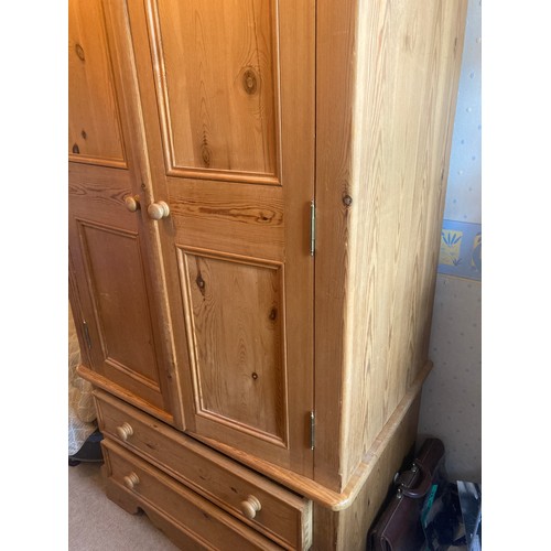 774 - Pine 2 drawer wardrobe over 2 drawers to base. 101 w x 67 d x 193cms h.