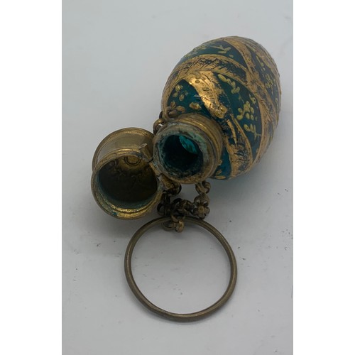 95 - Blue glass and gilt scent bottle with finger ring.