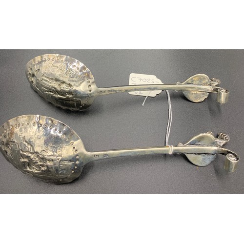 585 - Pair of hand chased Dutch silver spoons with cockerel mounts c1800. They have a sterling silver mark... 