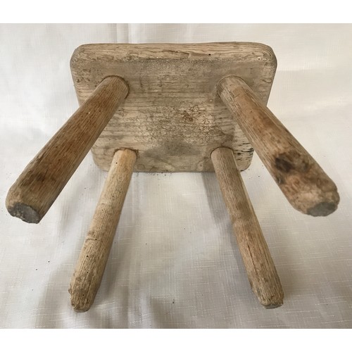 575 - A small oak four legged stool. 20cms w x 17cms x 20.5cms h.