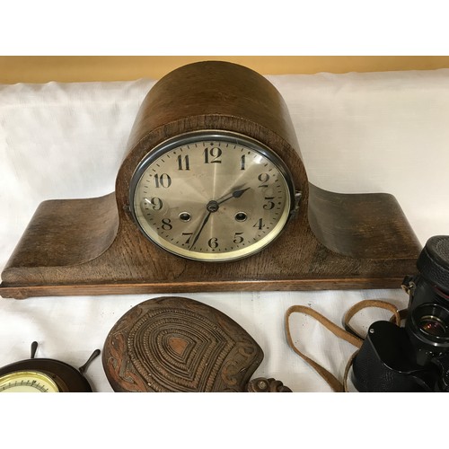 576 - A miscellany to include an oak mantle clock 52cms w x 25cms h, a ship's barometer 19cms w, a pair of... 