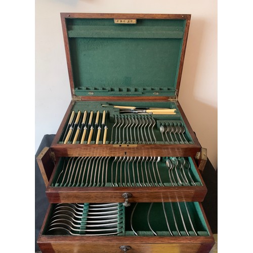 580 - A two drawer oak canteen of cutlery and contents.