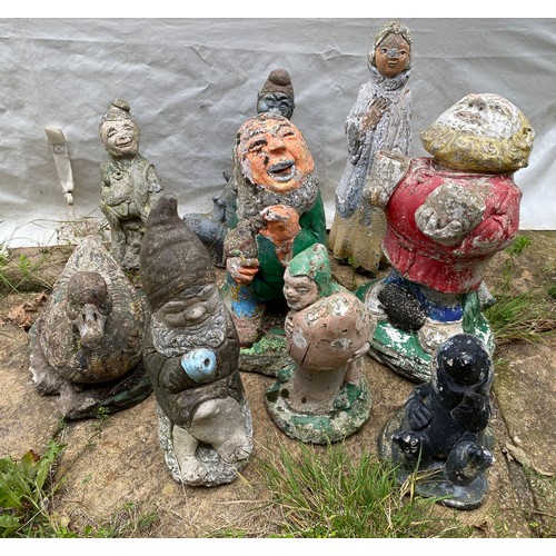 814 - Nine small garden ornaments to include duck, gnomes, seal, lady etc. Tallest 44cms.