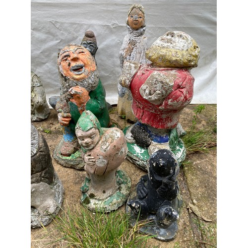 814 - Nine small garden ornaments to include duck, gnomes, seal, lady etc. Tallest 44cms.