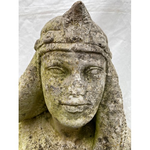 816 - A concrete Cleopatra garden statue. 85cms h.