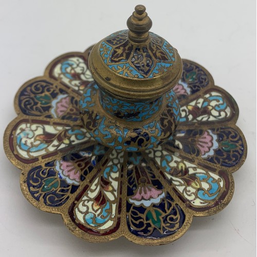 560 - A brass and enamel champlevé  inkwell 7.5cms h with glass liner.