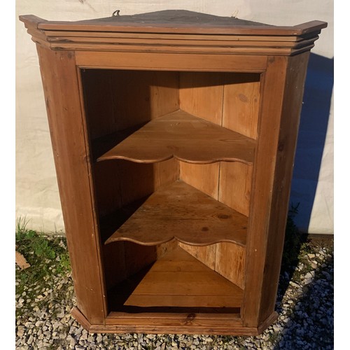 768 - An open pine corner cupboard. 98cms h x 71cms w.