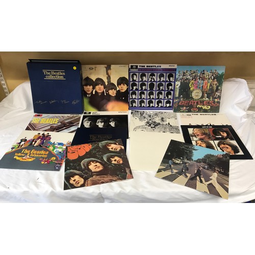 669 - The Beatles LP collection, 13 vinyl LPs with posters, blue presentation box. Parlaphone, facsimile s... 