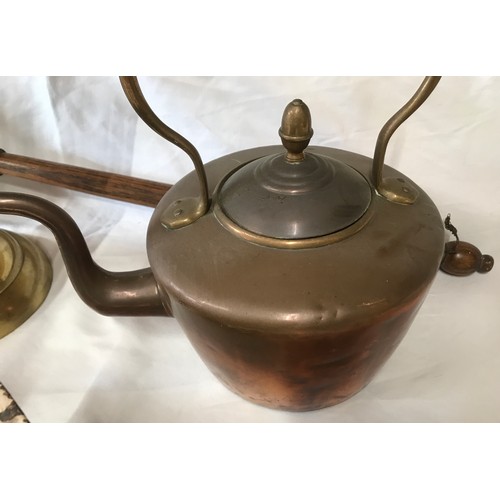 563 - Copper, brass and ironware, copper bed pan with oak handle, copper kettle 28cms h, brass trivet 25cm... 