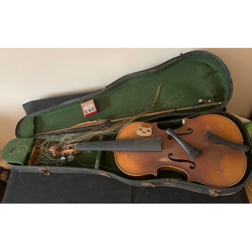 667 - A vintage violin and bow in case.