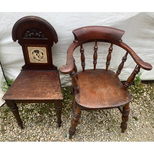 766 - A smokers bow armchair together with a 19thc hall chair with tile to the back.