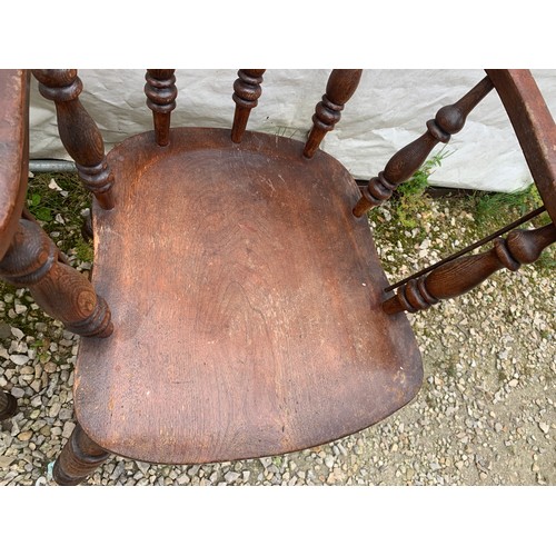 766 - A smokers bow armchair together with a 19thc hall chair with tile to the back.