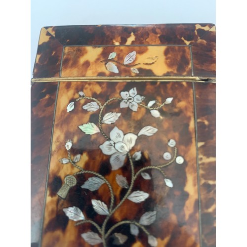 604 - A tortoiseshell and mother of pearl card case. 10.5 x 8cms.