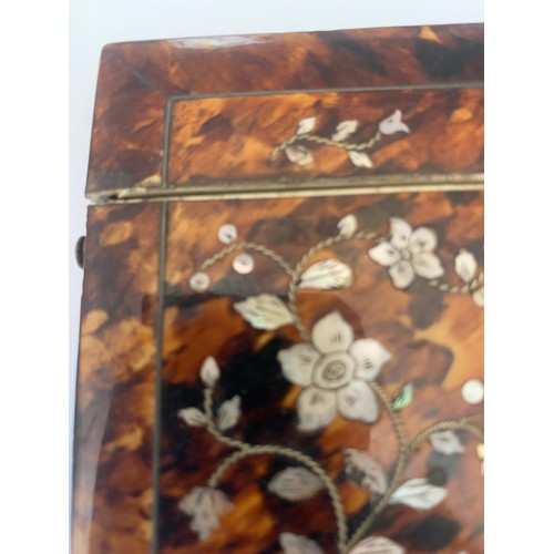 604 - A tortoiseshell and mother of pearl card case. 10.5 x 8cms.