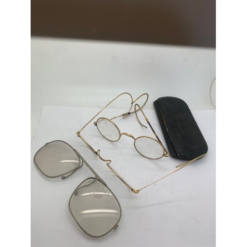 606 - Three pairs of vintage spectacles, including 2 yellow metal.