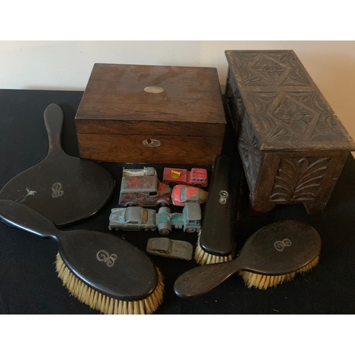 607 - Miscellany to include ebony backed mirror and brushes, two wooden boxes and various toys to include ... 