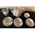 A Newhall silver shaped teapot circa 1790, jug, four tea bowls and three saucers.