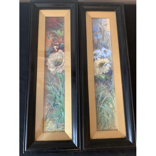 700 - Two watercolour paintings of flowers in ebonised frames with gilt mounts. 34 x 6cms. Signed L.R.J. H... 