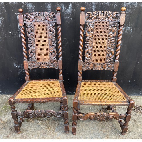 765 - A pair of Carolean style oak chairs.