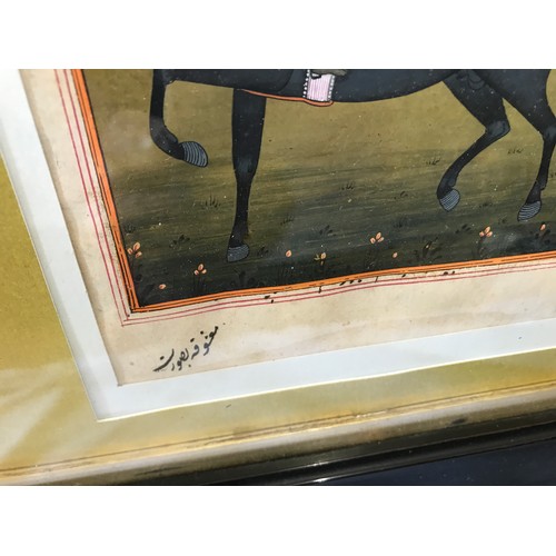 704 - Two ebony framed Indian paintings. Seated lady 20 x 12cms, warriors on horse back with signature 20 ... 