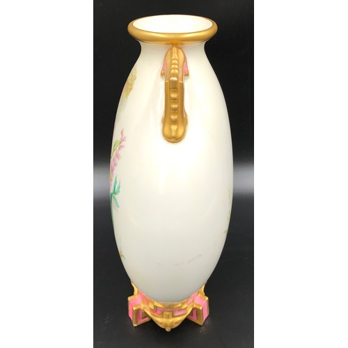 9 - A Royal Worcester moon vase with floral and butterfly decoration. 25.5cms l x 21cms w. Circa 1892.