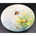 A Royal Worcester pedestal dish with floral and butterfly decoration. 23cms d x 5cms h.