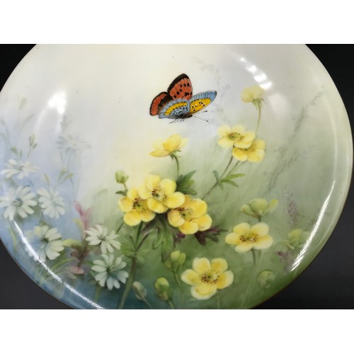 10 - A Royal Worcester pedestal dish with floral and butterfly decoration. 23cms d x 5cms h.