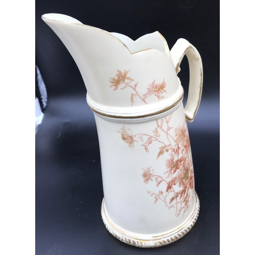 11 - A collection of Royal Worcester to include a basket vase 24cms h x 207cms w, tusk jug 20cms h, flora... 