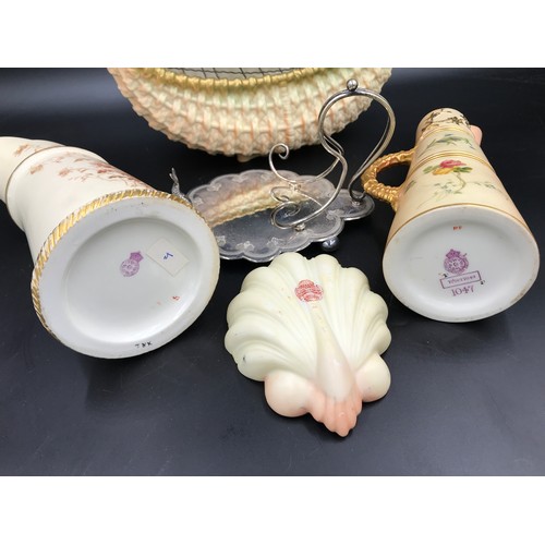 11 - A collection of Royal Worcester to include a basket vase 24cms h x 207cms w, tusk jug 20cms h, flora... 